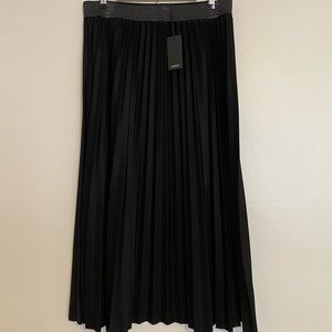 Pleated black maxi skirt with metallic undertones